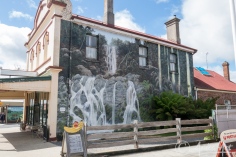 Large mural of waterfall on wall of Restaurant-Cafe